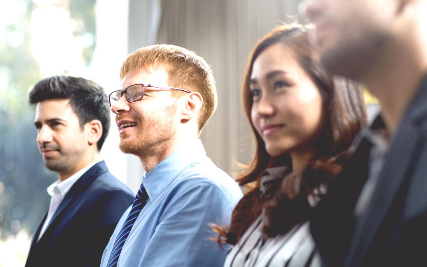 Business professional reviewing budget documents and financial planning materials